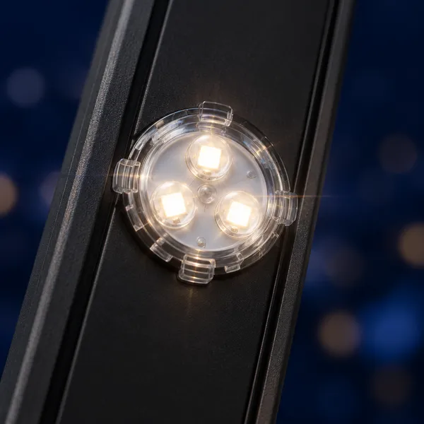 Close-up of a single LED pod glowing warm white